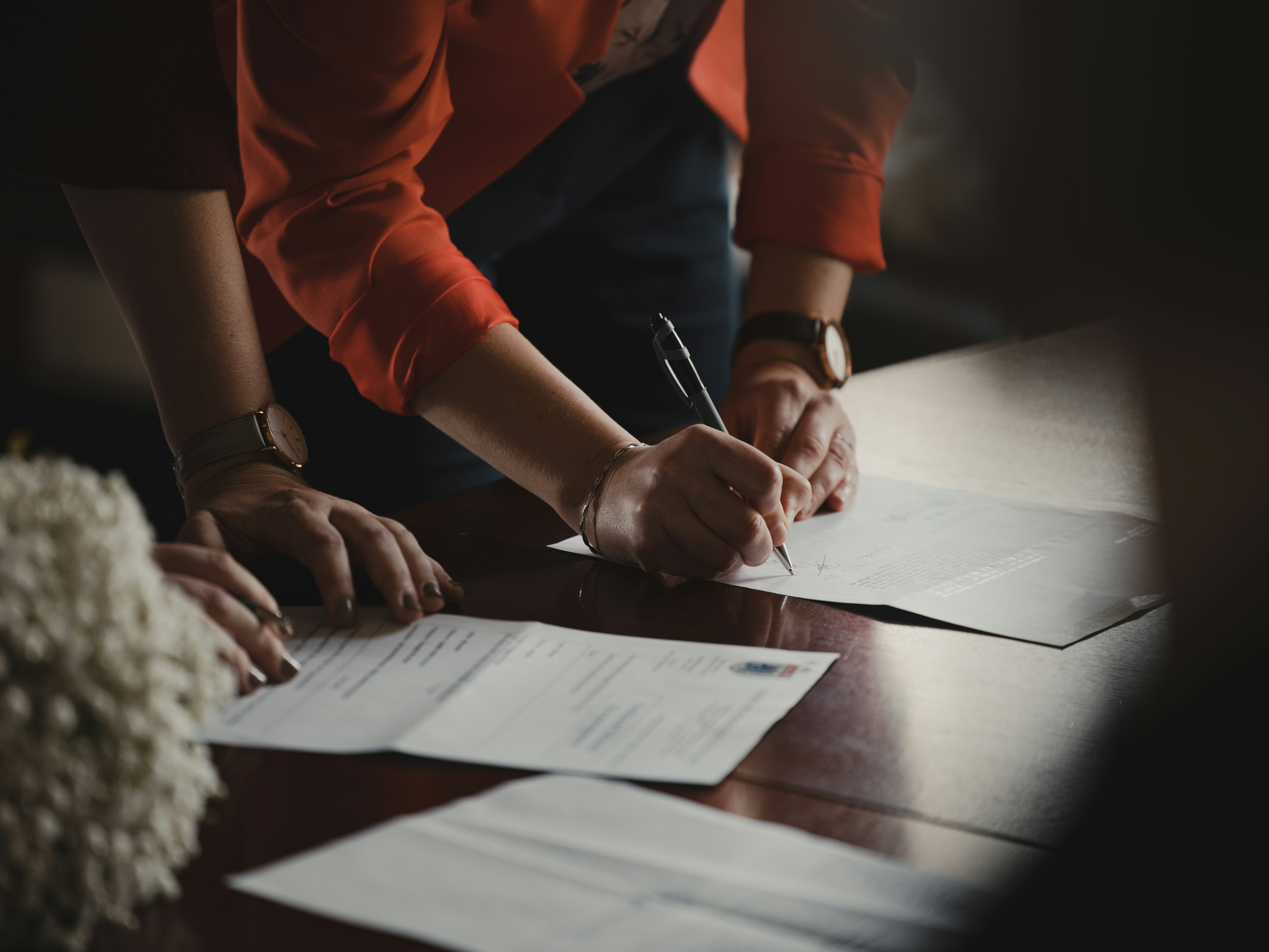 Documents being reviewed and signed